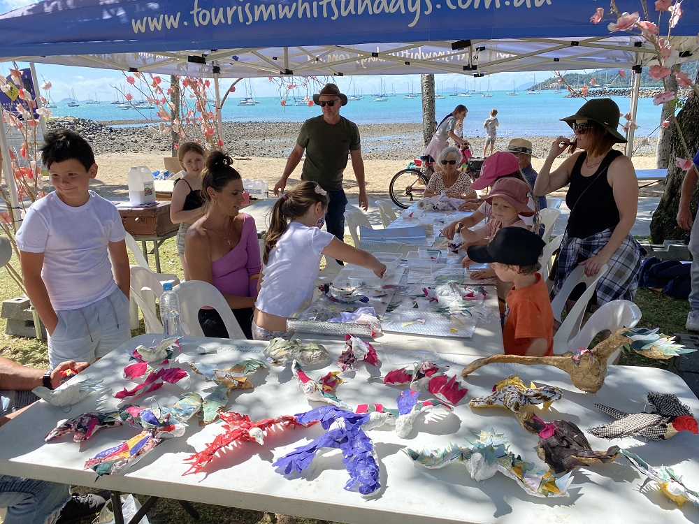 Group of children and adults at the beach